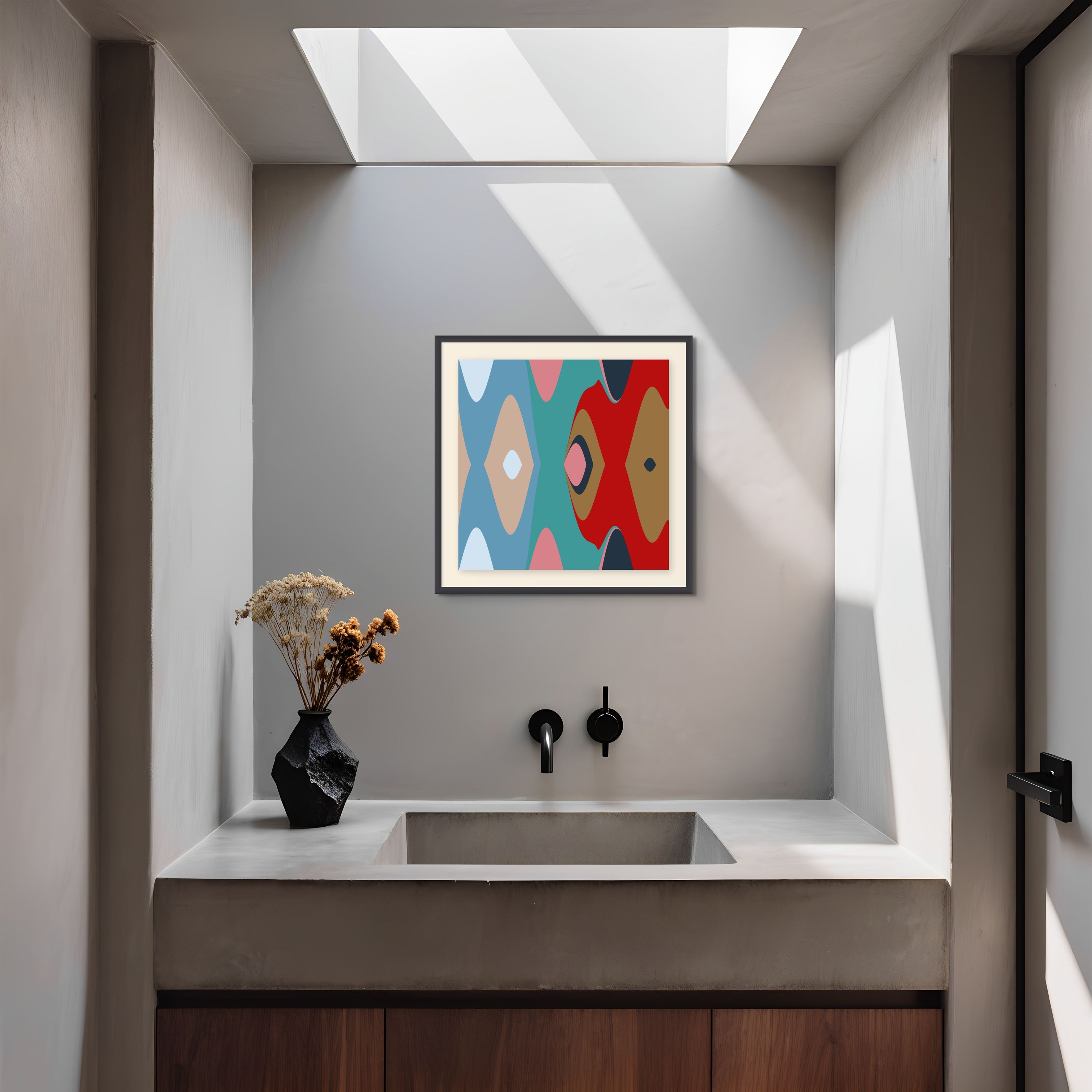 A modern minimalist bathroom with a concrete sink, black fixtures, dried flowers, and Beau Monet’s Belief Through Violence art on the wall, all bathed in natural light from a skylight above.